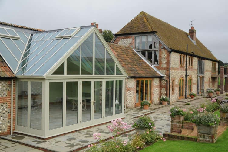 Wooden conservatory in barn conversion
