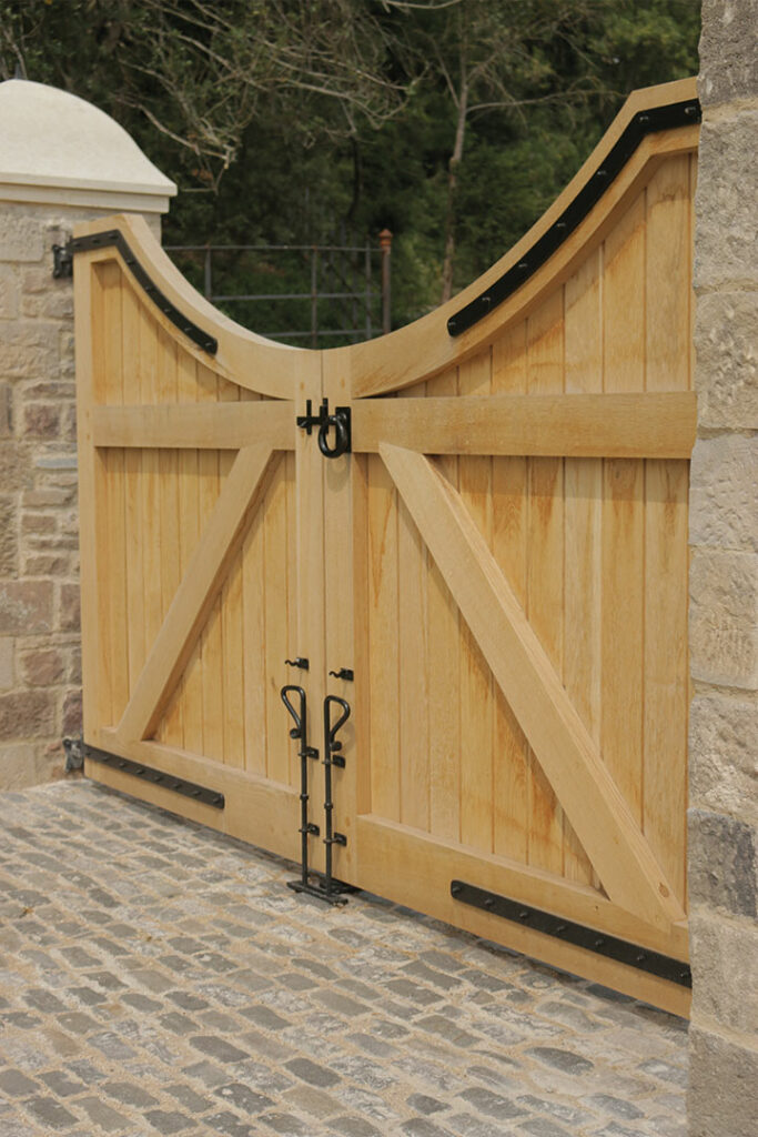 Handmade wooden gate with metal furniture