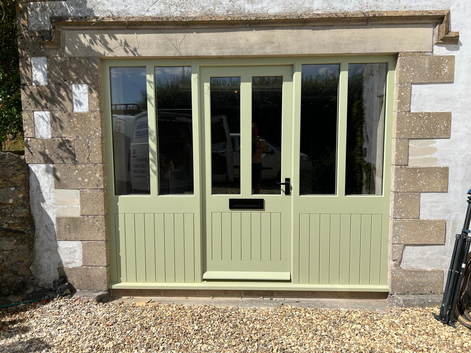 A new front entrance and sun lounge for stone cottage in Babington, Somerset